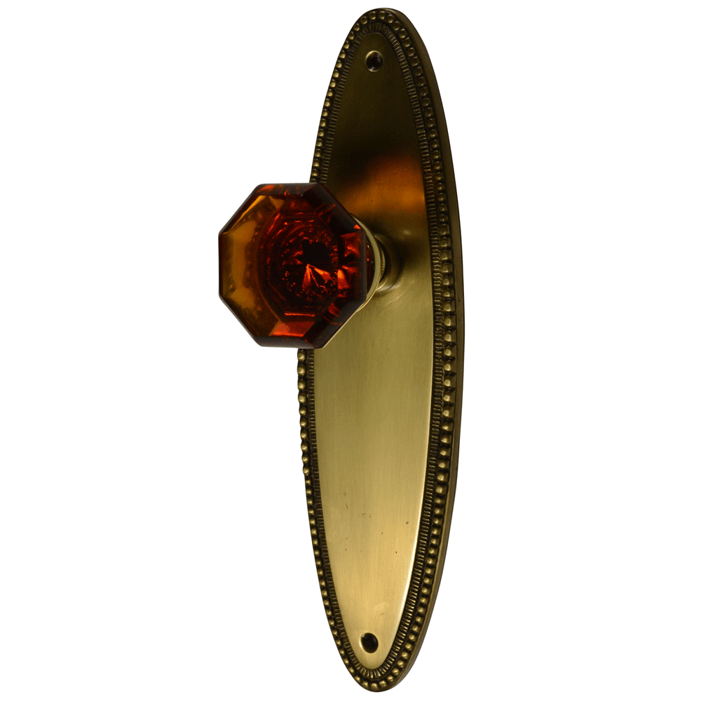 Oval Beaded Backplate Door Set with Octagon Amber Glass Door Knobs (Several Finishes Available) COPPER MOUNTAIN HARDWARE